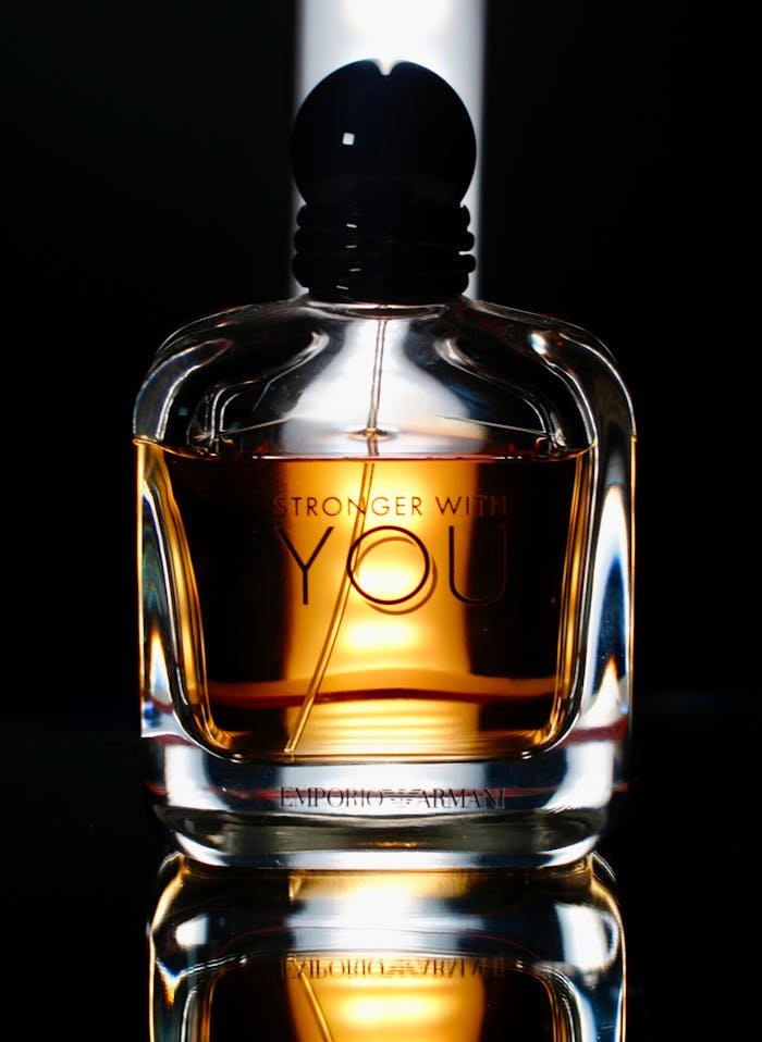 gallery-03 Stylish cologne bottle captured with dramatic lighting, showcasing elegance.